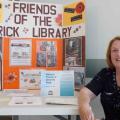 Sue MacDougall hosts the membership table for National Friends of Libraries Week